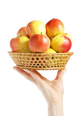 Ripe apples in a wum bowl on a hand