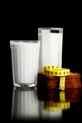 Measuring tape, bread and glass with the kefir