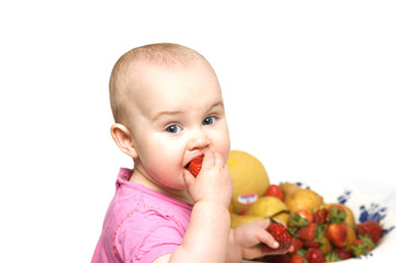 Fototapeta premium Baby eating strawberry