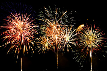 Colorful firework show finale with multiple bursts