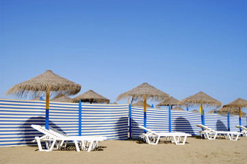 Beach chairs and sun shades