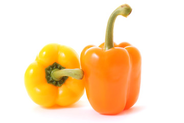 Orange and yellow peppers isolated on white