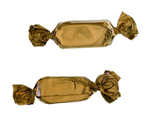 Two gold sweets close-up
