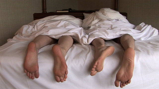 Feet of Couple in Bed, Seattle, Washington
