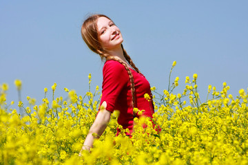 Fototapeta premium happy girl with long hair in yellow flowers