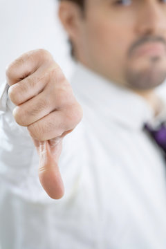 The young businessman shows gesture by a hand