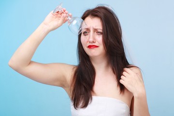 Depressed bride with empty glass