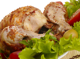 grilled chicken whole with vegetables on salad leafs