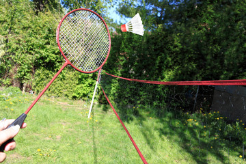 Playing badminton outdoors