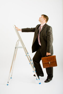 Business man with ladder