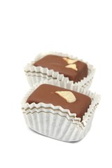 Sweet  milk chocolate pralines isolated on white background