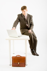 Young business man with laptop