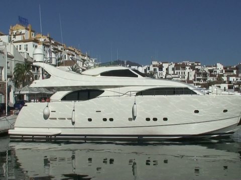 Large white expensive yachts in Puerto Banus port in Spain