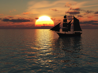Ship out at sea at sunset.