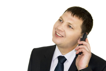 Businessman discussing to the mobile phone isolated over white b