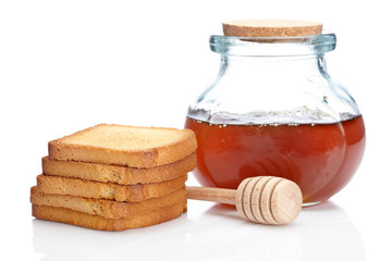 Fototapeta na wymiar Honey jar and toasts
