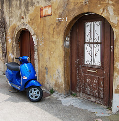 Blue scooter over old wall - 14241854