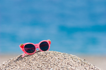 Fototapeta na wymiar Sunglasses on pebbles