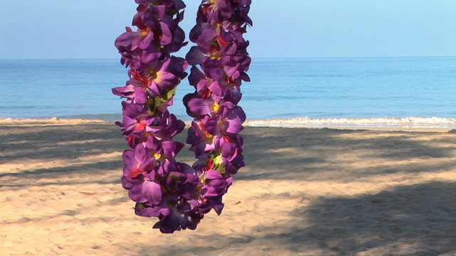 Traditional Hawaiian lei on the beach, Big Island of Hawaii.
