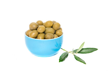 Blue cup full of green olives