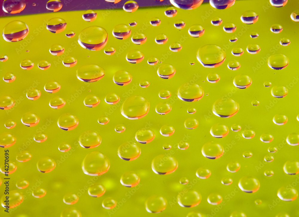 Wall mural colored drops on the surface