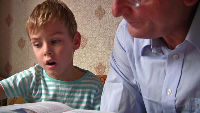 senior with child read book