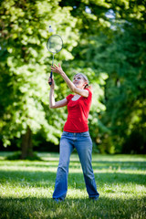girl playing badminton in the park 2