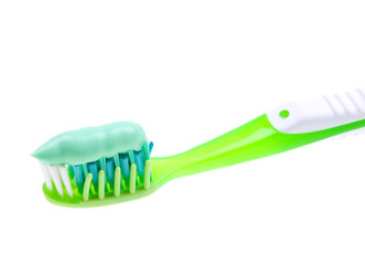 Close-up of a toothbrush with paste isolated on white