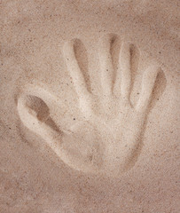 handprint in the sand