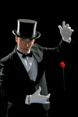 Young magician with flying rose