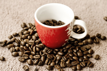 Cup of coffee with coffee beans