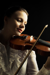 beautiful woman playing the viloin
