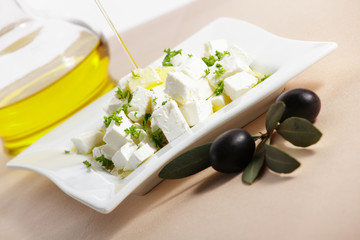 feta cheese with olive branch