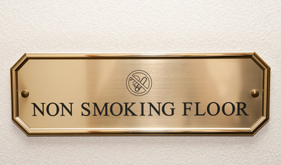 Brass plate restricting smoking on hotel floor