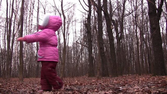 little girl rotating in winter park