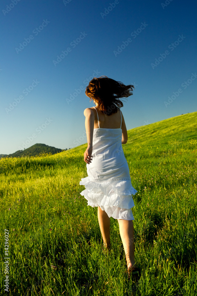 Poster Young woman running on a beautiful springfield