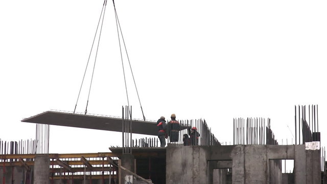 Montage of plate at construction of building