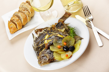 Baked turbot with vegetables and white wine
