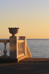 Seafront balustrade in the light of setting sun
