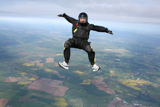 Skydiver in a sit position while in freefall