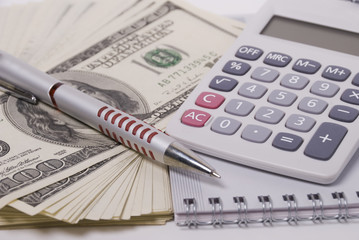 Money, pen and calculator