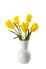 White vase with yellow tulips isolated over white