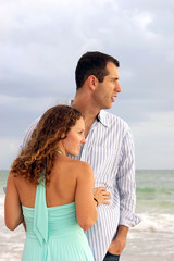 profile portrait of well dressed young couple looking out at the