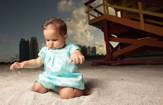 Cute baby playing on the sand