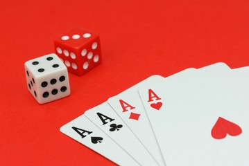 Dices and Playing Cards on Red