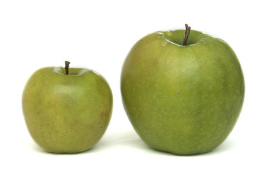 Two different green apples on a white background