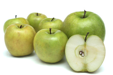 Many green apples on a white background