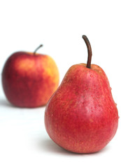 One red juicy pear and red apple