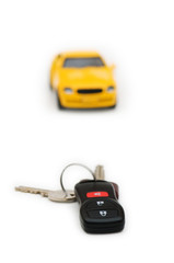 Fototapeta premium Car keys and car at background isolated on white