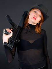 young woman holding the gun